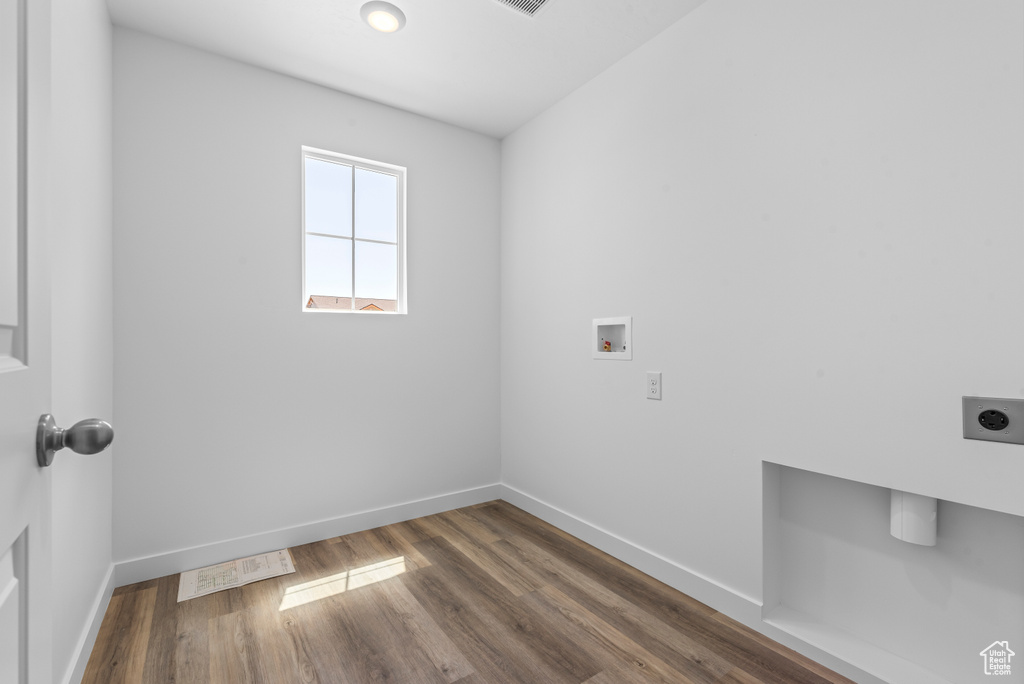 Laundry room featuring laundry area, electric dryer hookup, baseboards, and hookup for a washing machine