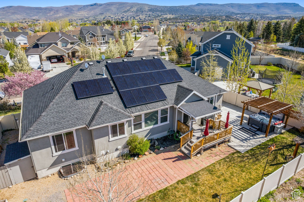 Birds eye view of property featuring a mountain view and a residential view