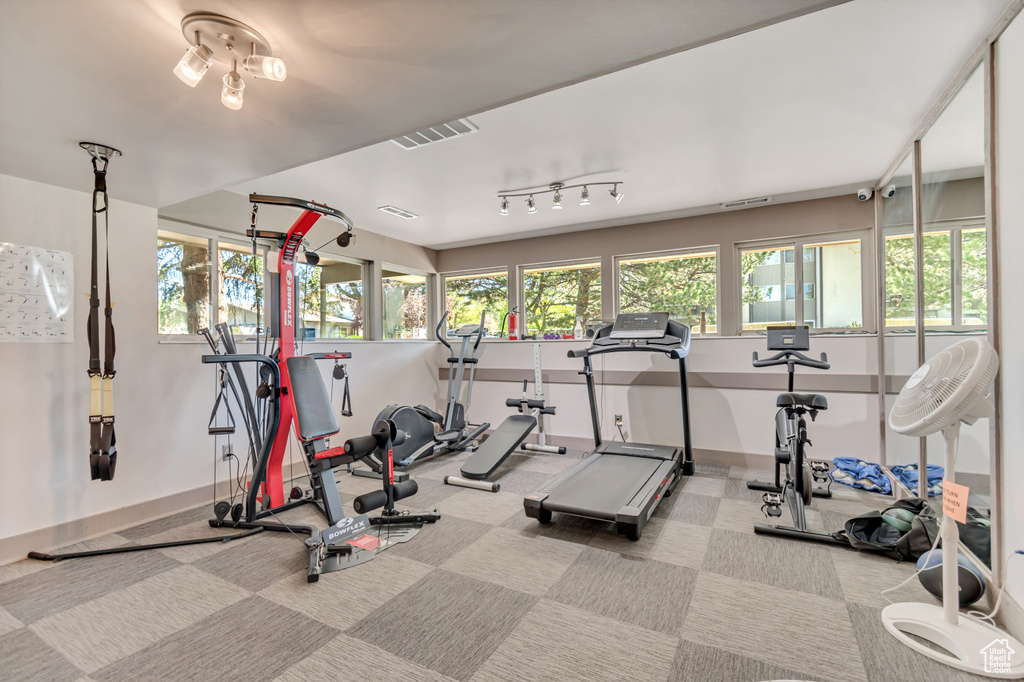 Workout area with baseboards and visible vents
