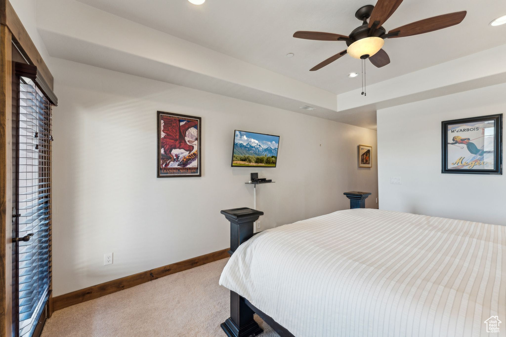 Carpeted bedroom featuring baseboards, a ceiling fan, and recessed lighting