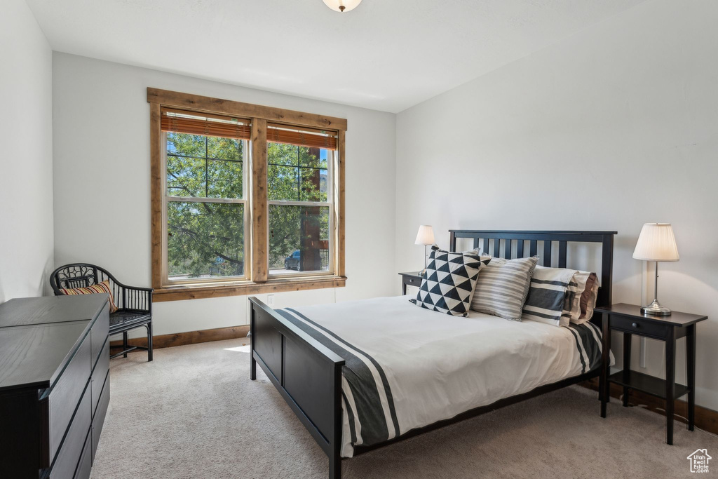 Carpeted bedroom with baseboards