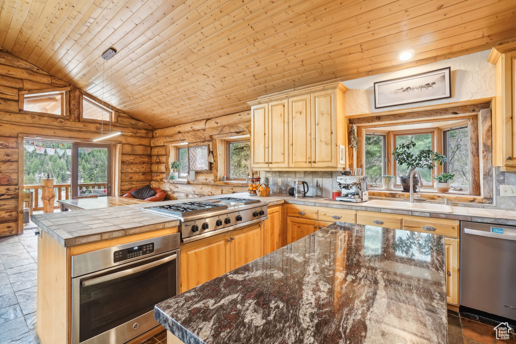 Kitchen with wooden ceiling, log walls, a sink, a peninsula, and appliances with stainless steel finishes