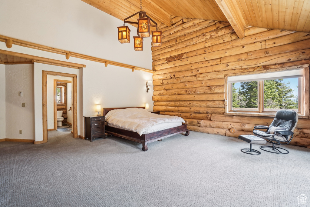 Bedroom with wood ceiling, log walls, beam ceiling, and carpet floors