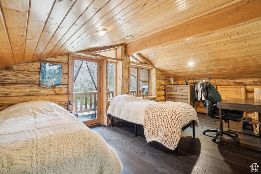Bedroom featuring lofted ceiling, wood ceiling, rustic walls, and access to exterior
