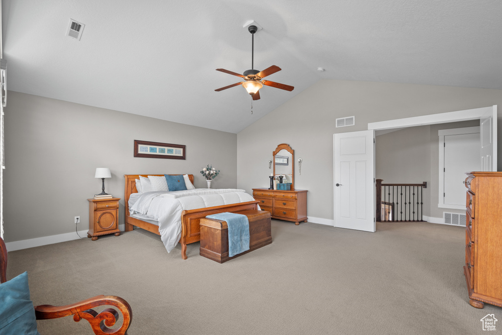 Bedroom with baseboards, visible vents, and light colored carpet