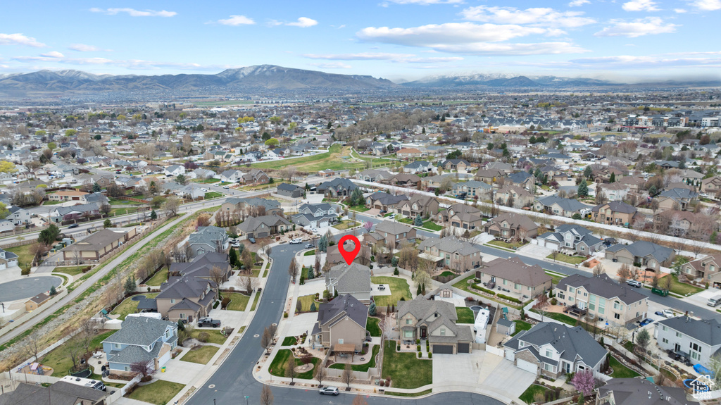 Birds eye view of property featuring a mountain view and a residential view