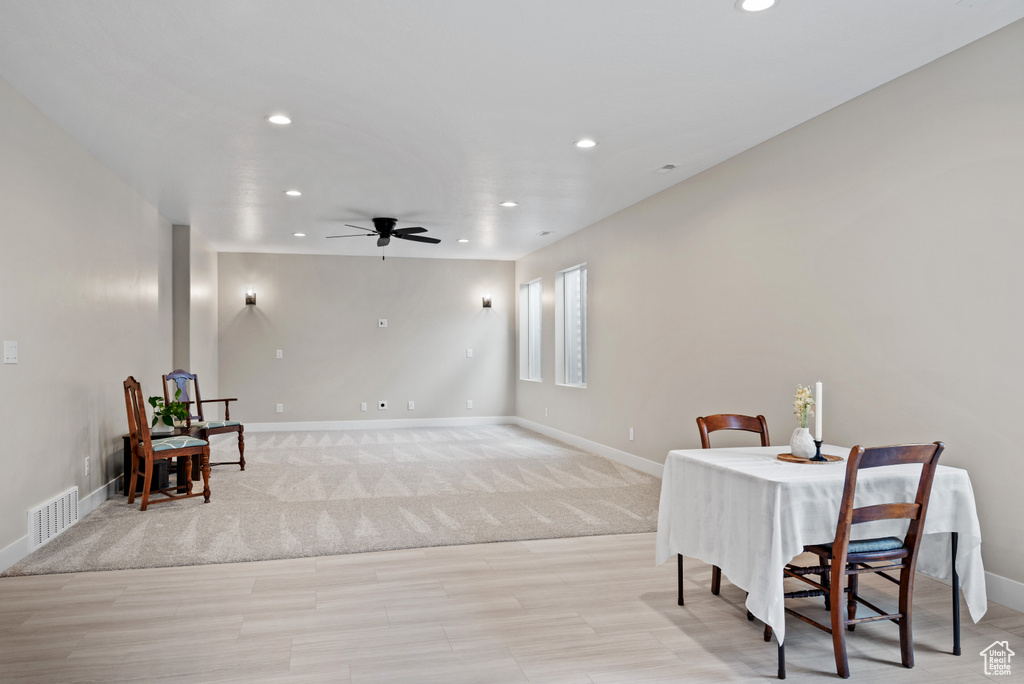 Dining area featuring light wood-style flooring, a ceiling fan, visible vents, baseboards, and recessed lighting