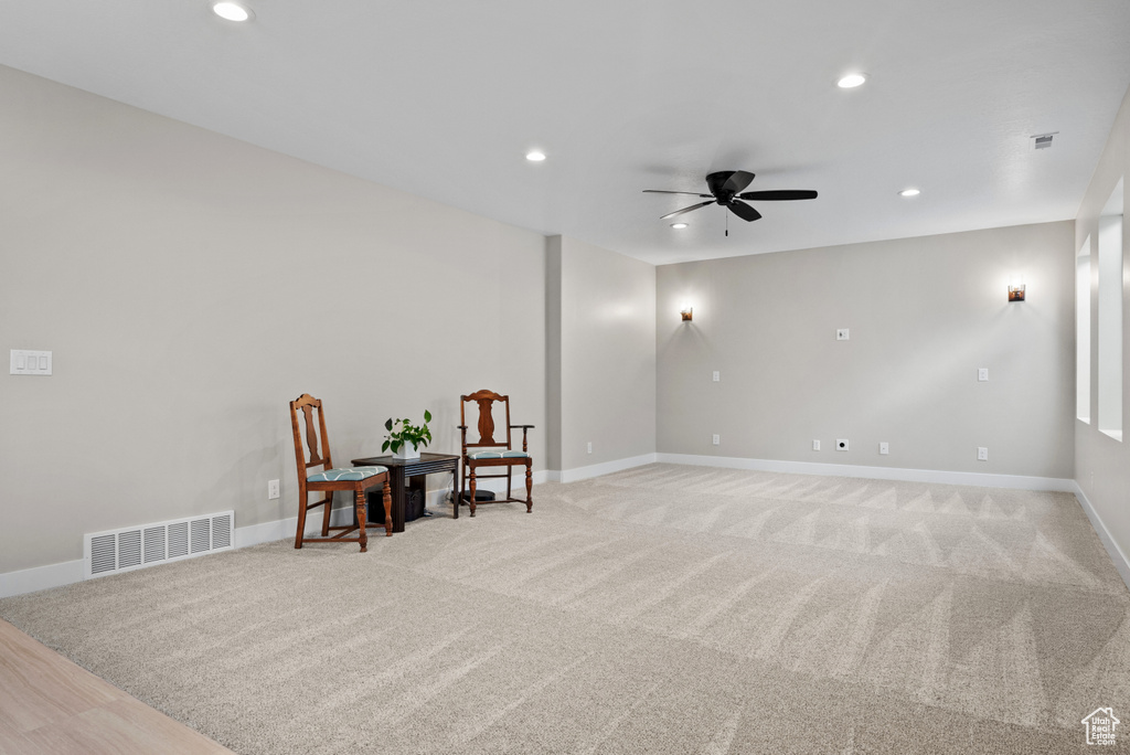 Sitting room featuring a ceiling fan, visible vents, and recessed lighting
