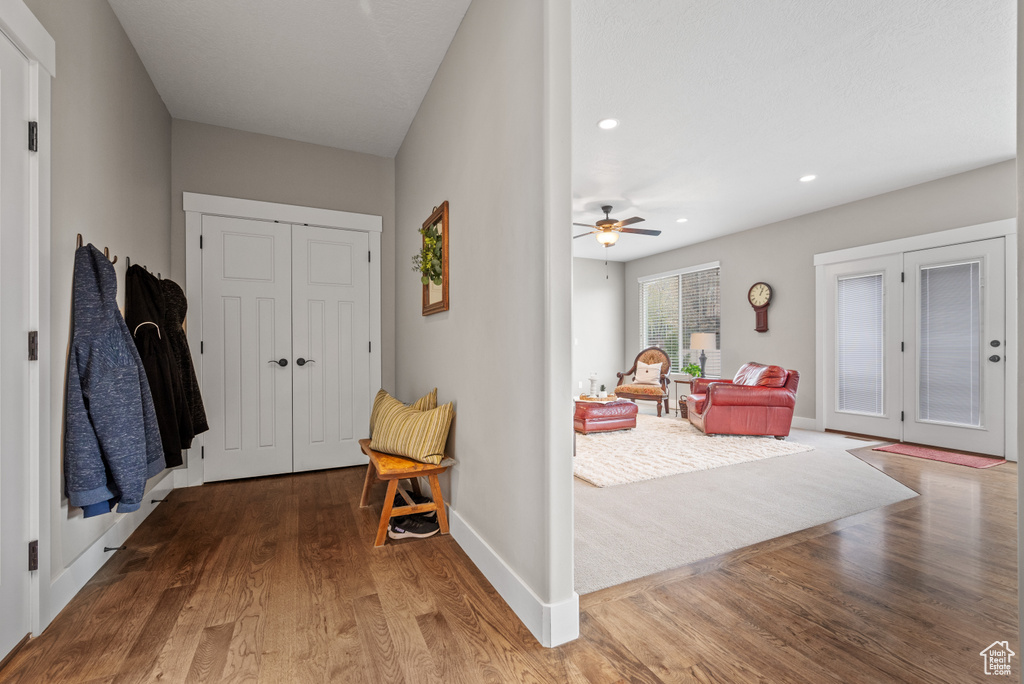 Foyer entrance with ceiling fan, recessed lighting, baseboards, and wood finished floors