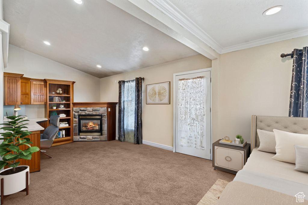 Bedroom featuring light carpet, recessed lighting, a stone fireplace, ornamental molding, and vaulted ceiling