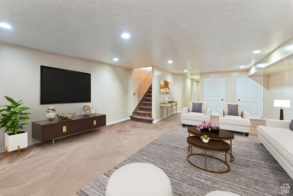 Living room with recessed lighting, carpet, stairway, and baseboards