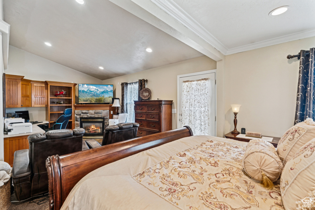 Bedroom featuring a fireplace, recessed lighting, ornamental molding, and vaulted ceiling