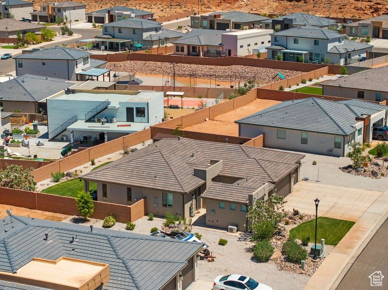 Aerial perspective of suburban area featuring a mountainous background