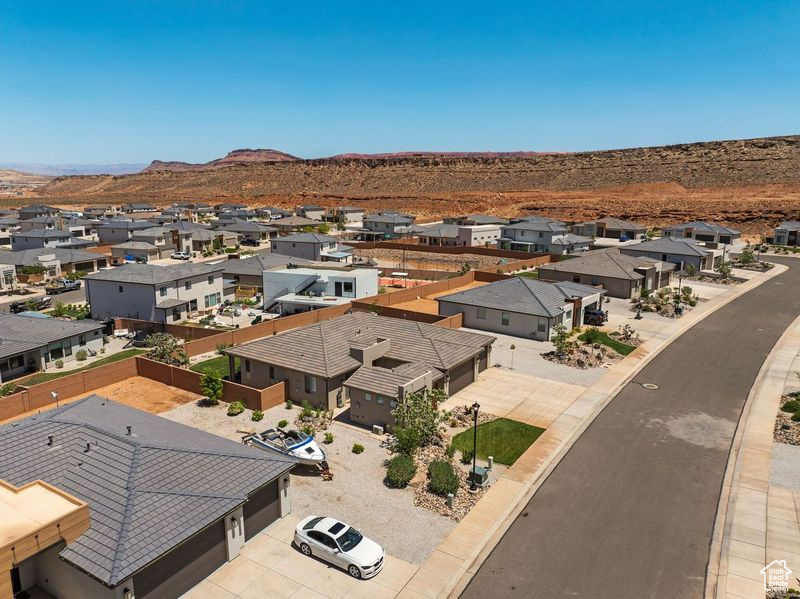 Aerial perspective of suburban area with a mountain backdrop