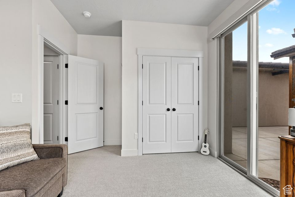 Living area featuring carpet