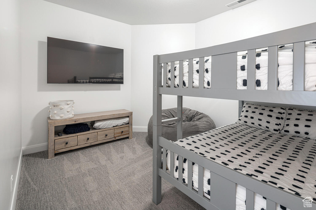 Carpeted bedroom with baseboards