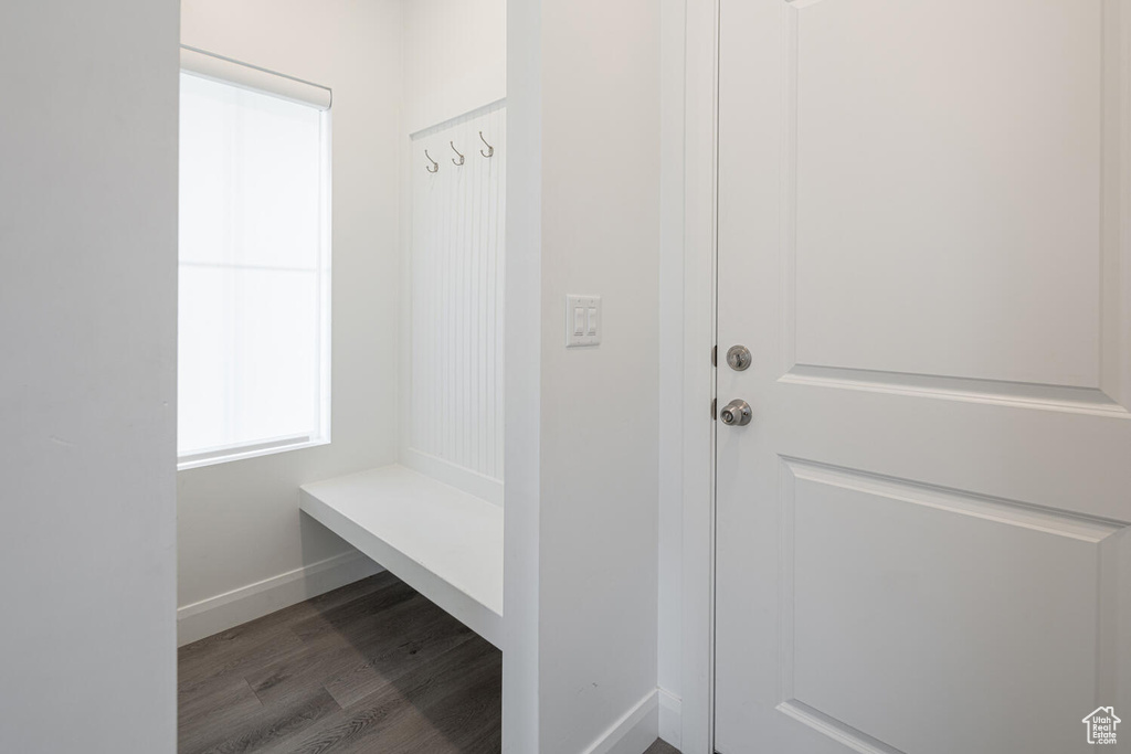 Mudroom featuring wood finished floors and baseboards