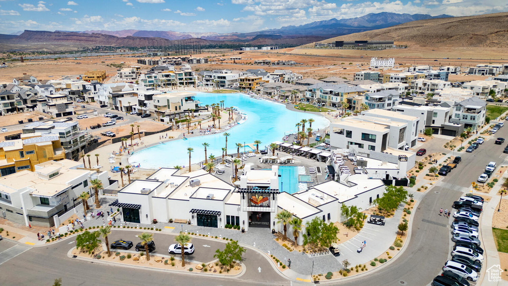 Birds eye view of property with a water and mountain view