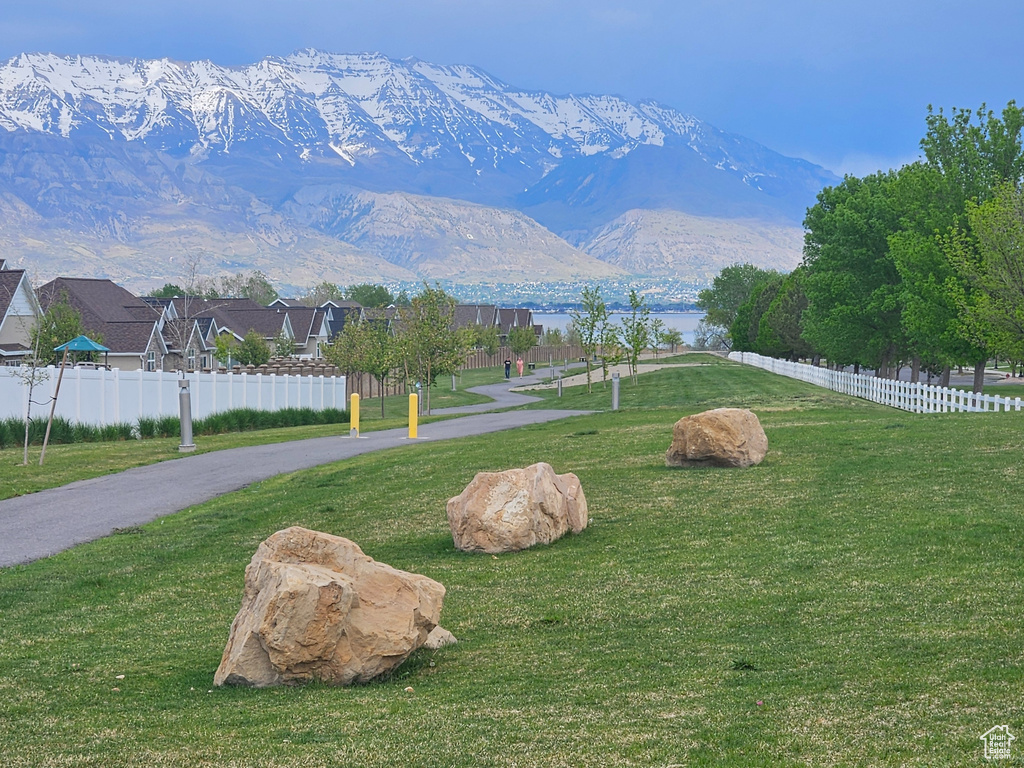 View of yard featuring fence and a mountain view
