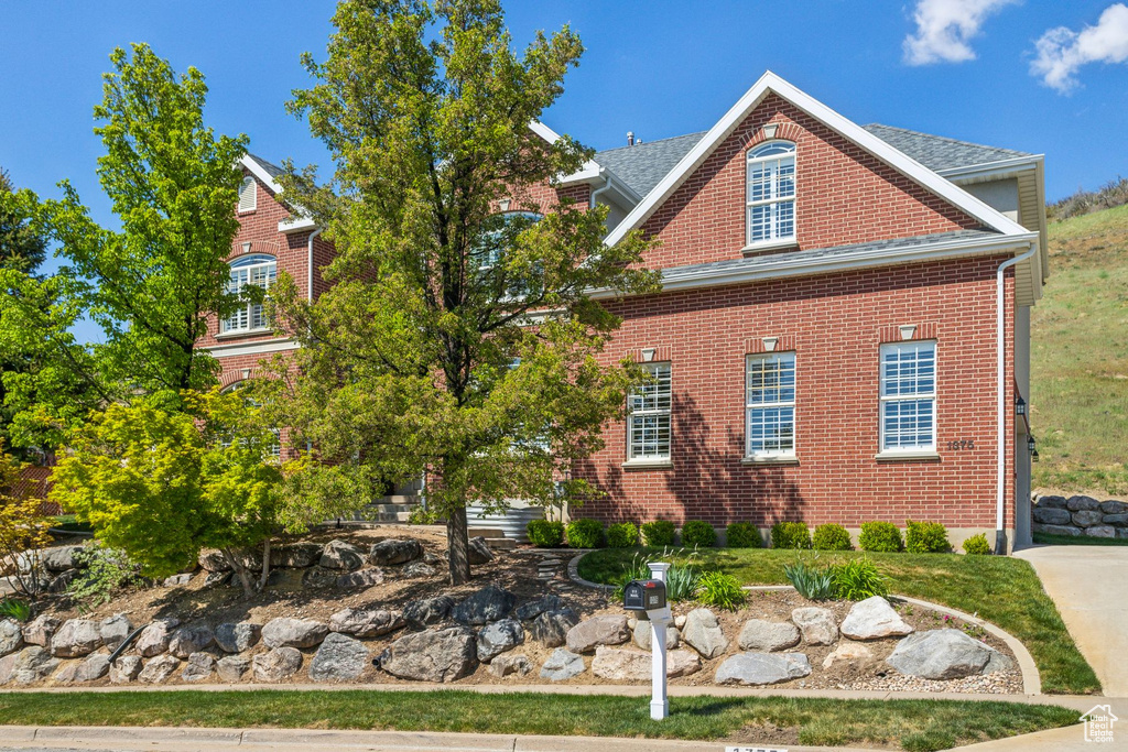 View of side of home featuring brick siding