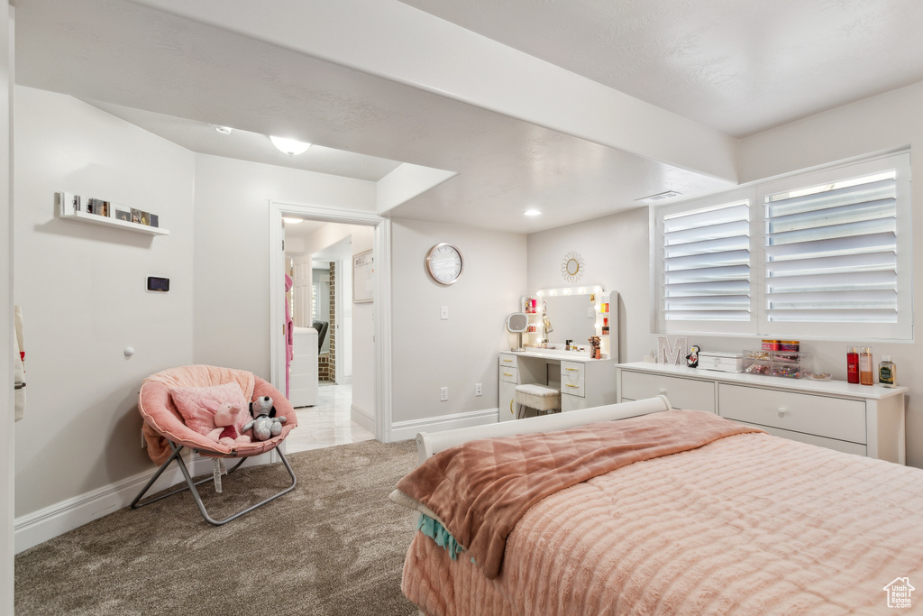 Carpeted bedroom with baseboards