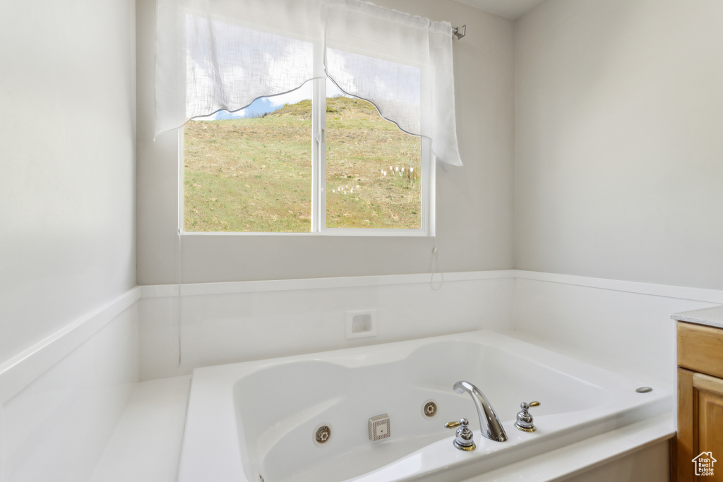 Bathroom featuring a tub with jets