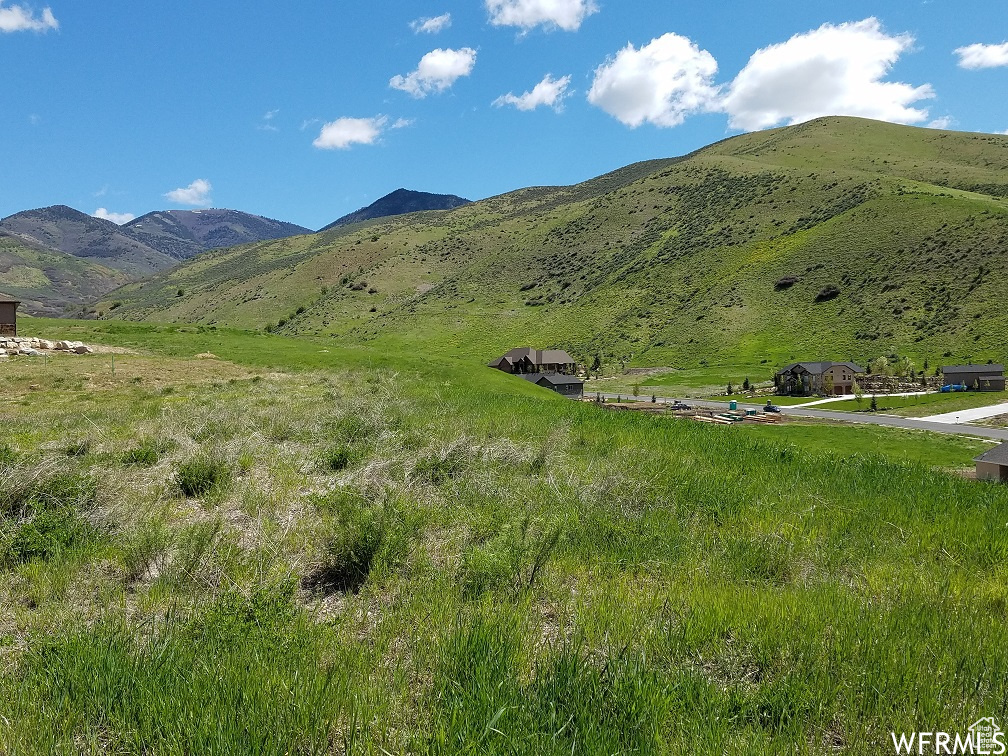 Property view of mountains with a rural view