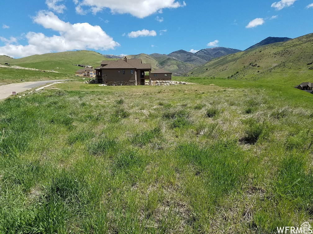 Property view of mountains with a rural view