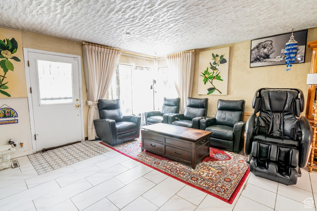 Living room featuring a textured ceiling