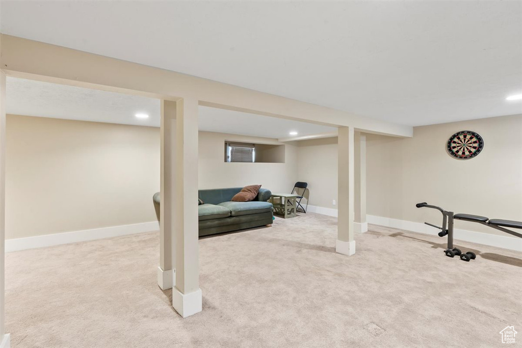 Finished below grade area with carpet flooring, recessed lighting, and baseboards