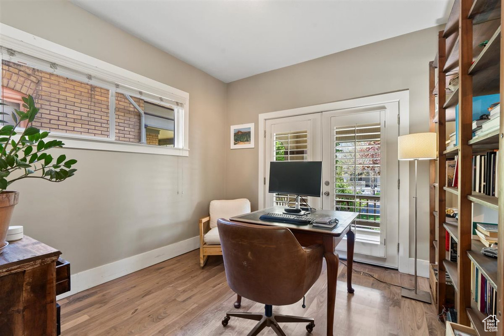 Home office featuring baseboards and wood finished floors