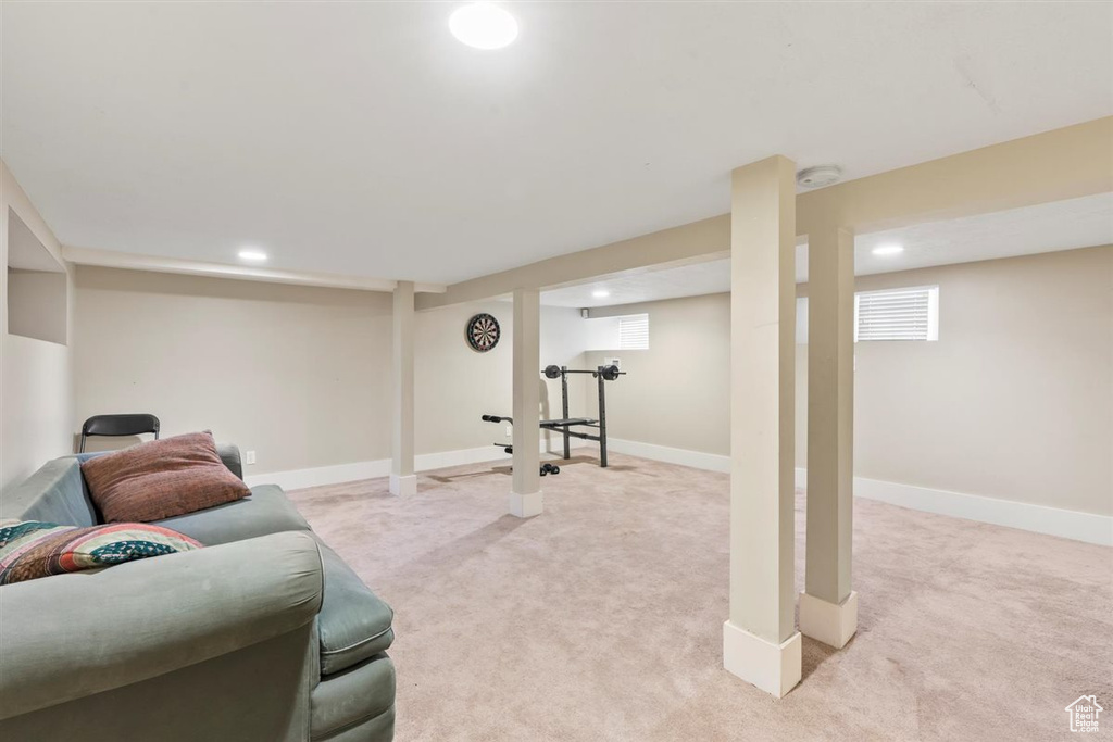 Living room with baseboards, light carpet, and recessed lighting