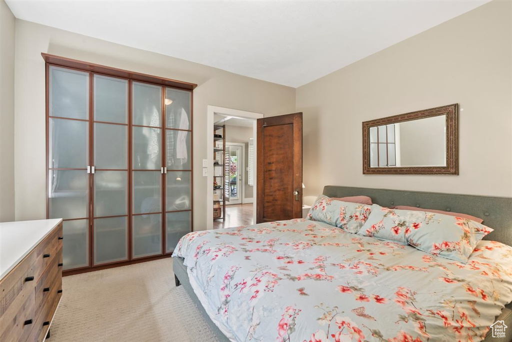 Bedroom with light colored carpet