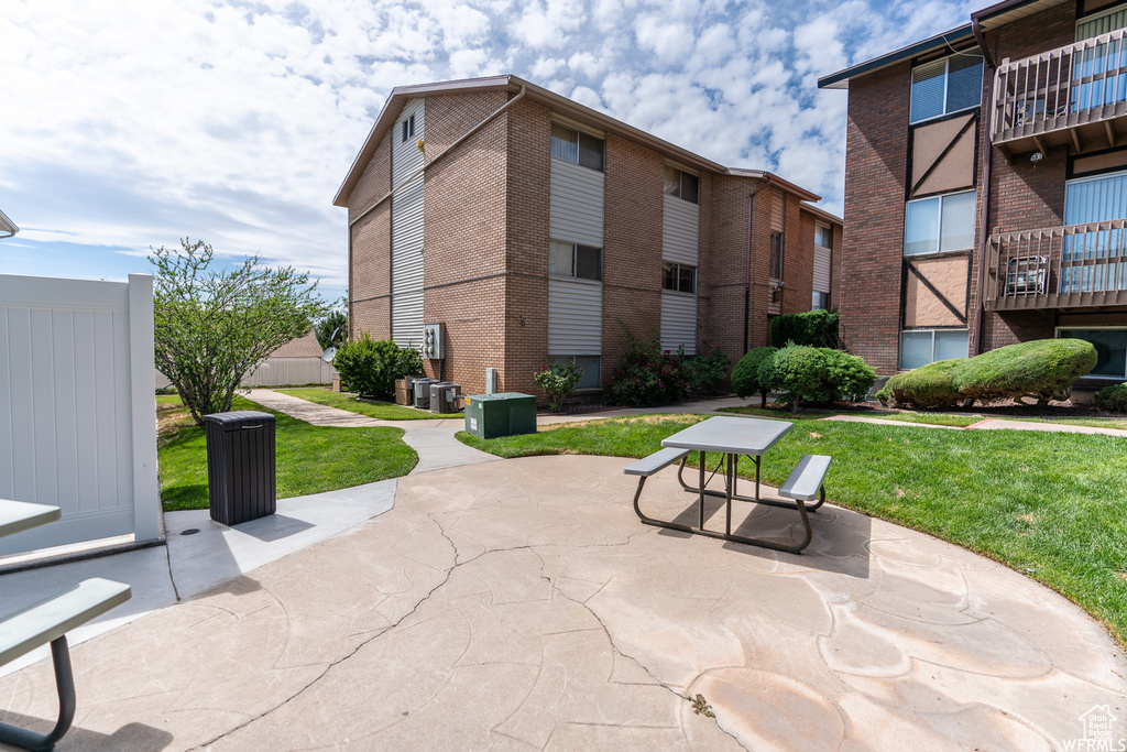 View of community featuring a yard and a patio