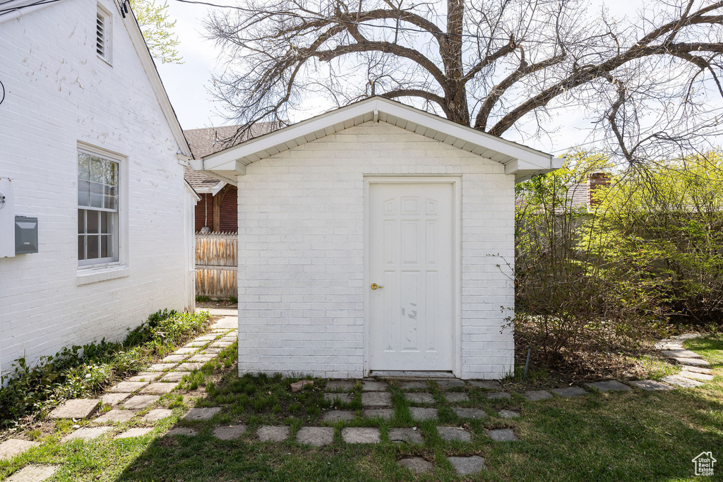 View of shed with fence