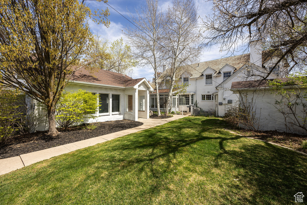 View of yard featuring fence