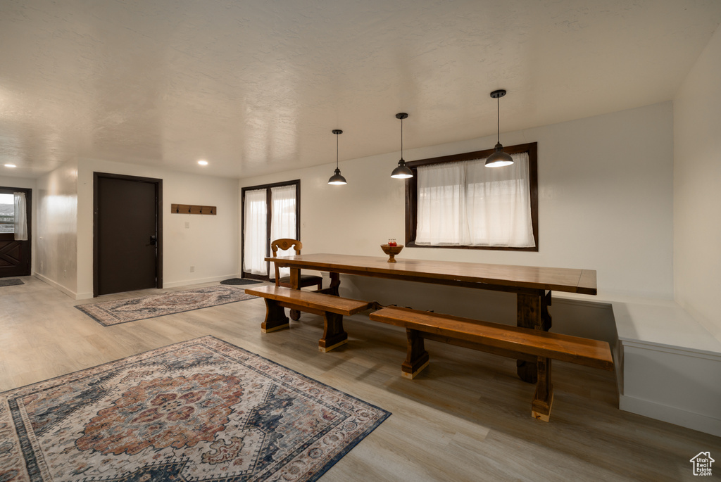 Dining space featuring wood finished floors and baseboards