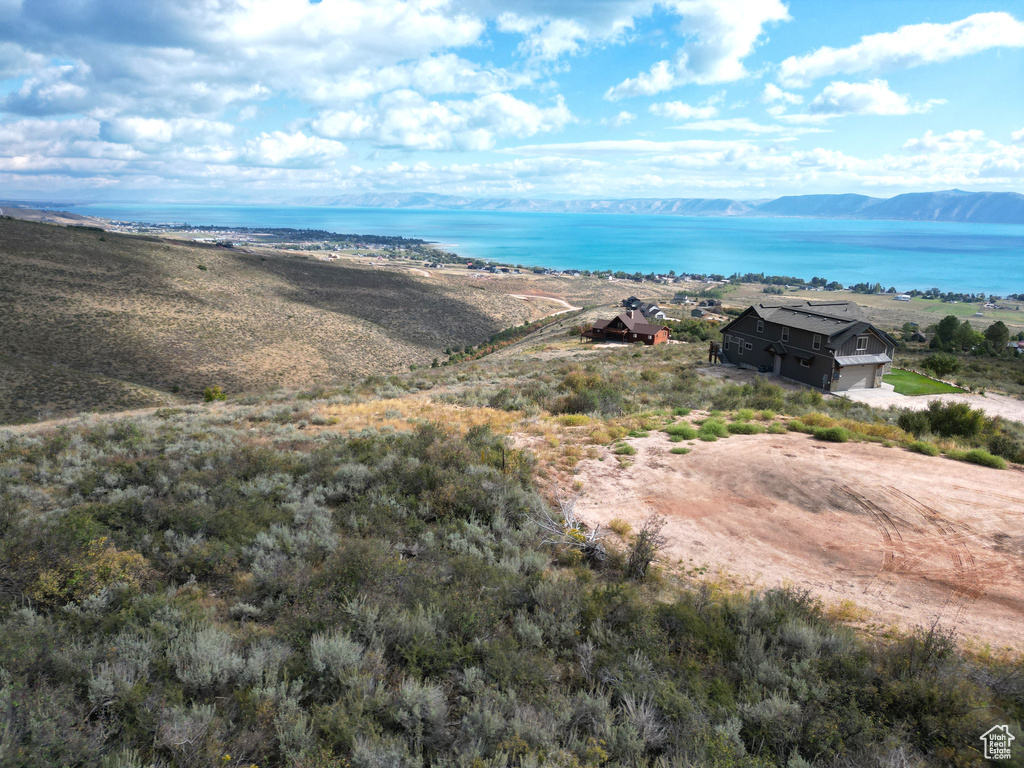 Property view of mountains with a water view