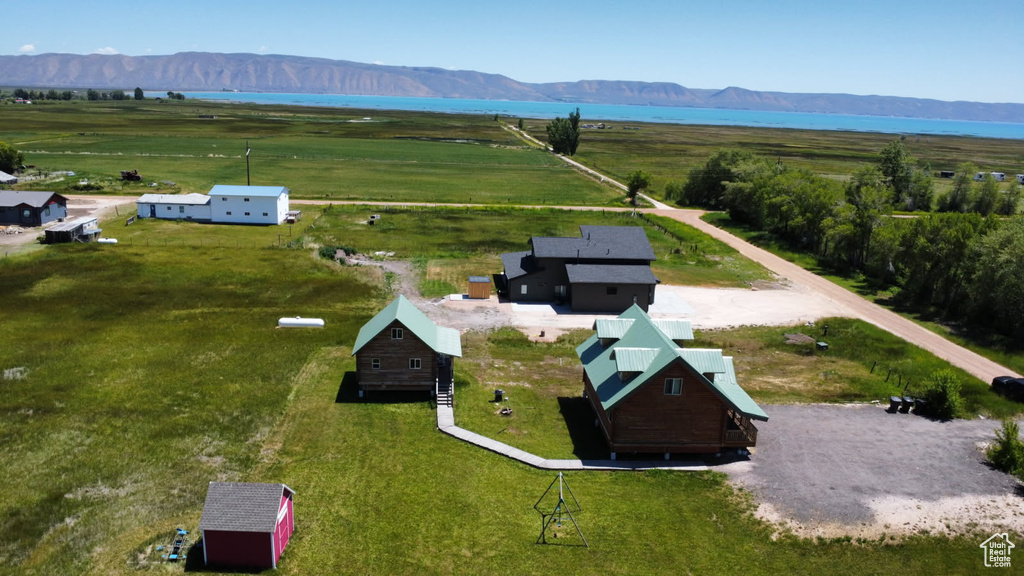Aerial view of sparsely populated area with a water and mountain view