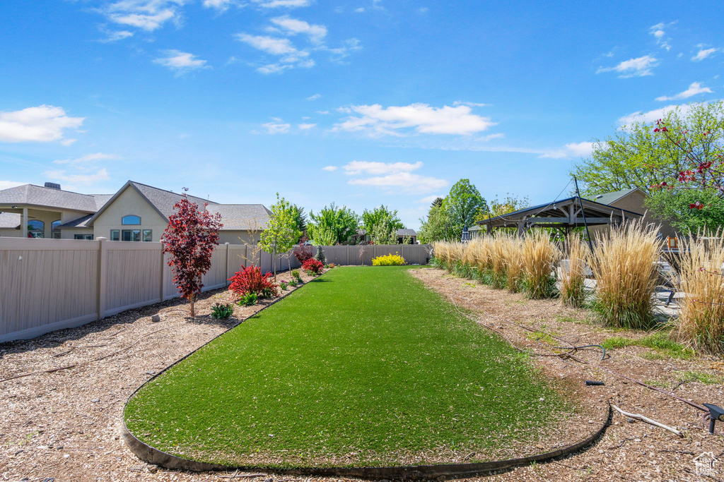 View of yard with a fenced backyard