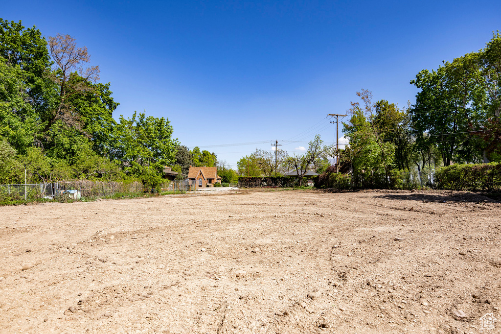 View of yard featuring fence