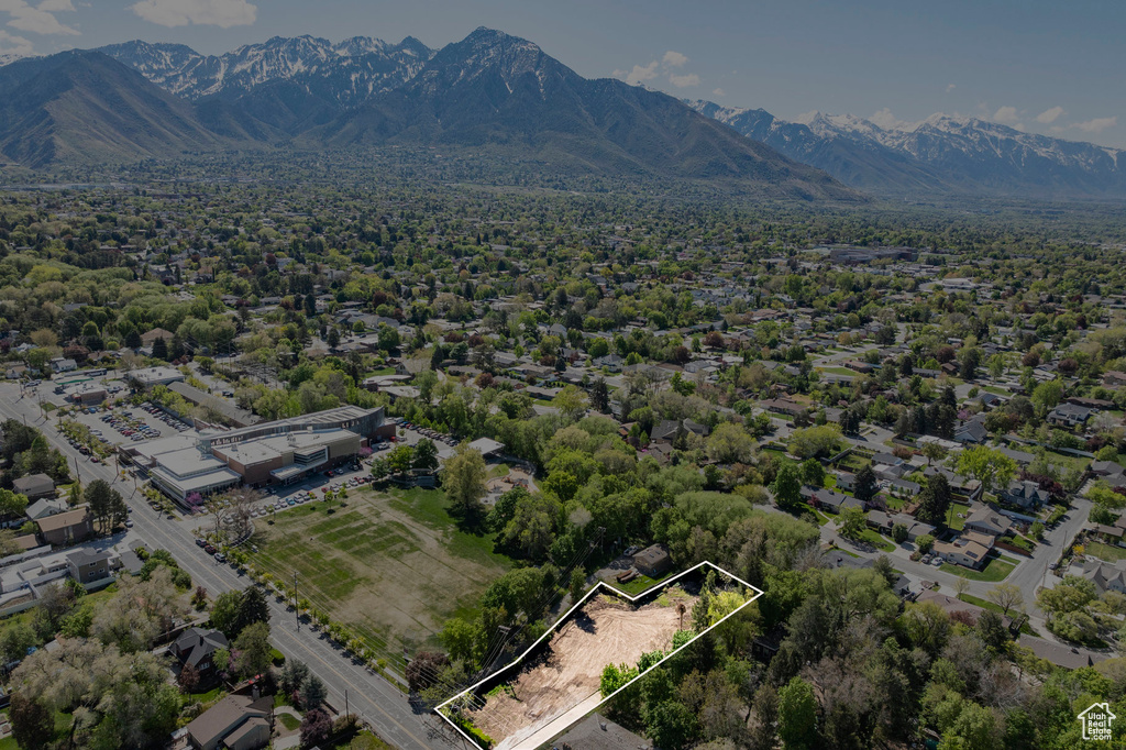 Birds eye view of property with a mountain view