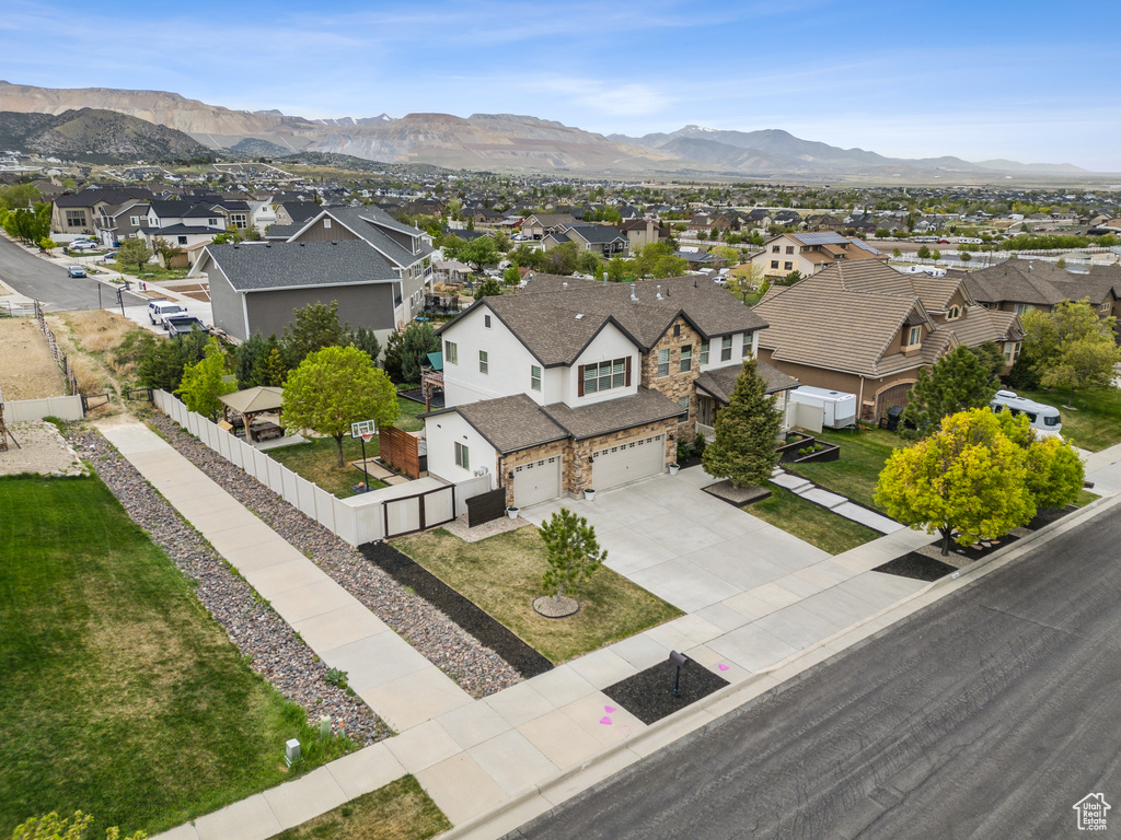 Drone / aerial view with a residential view and a mountain view