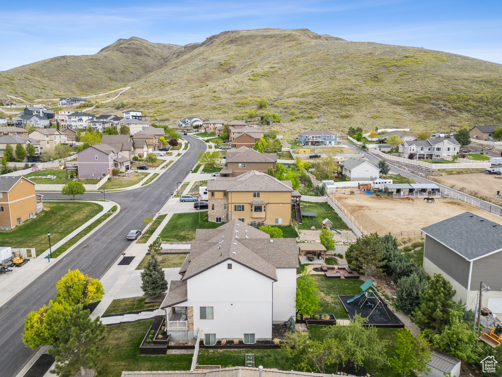 Drone / aerial view with a residential view and a mountain view