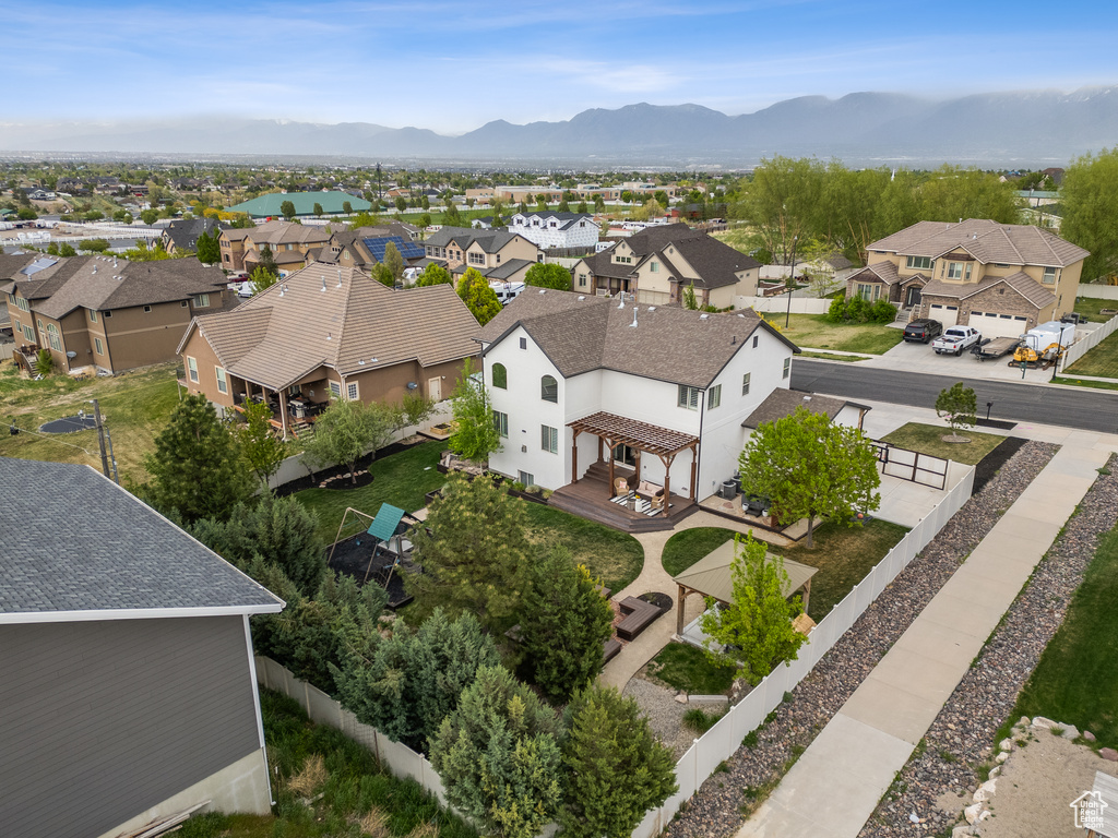 Drone / aerial view with a mountain view and a residential view