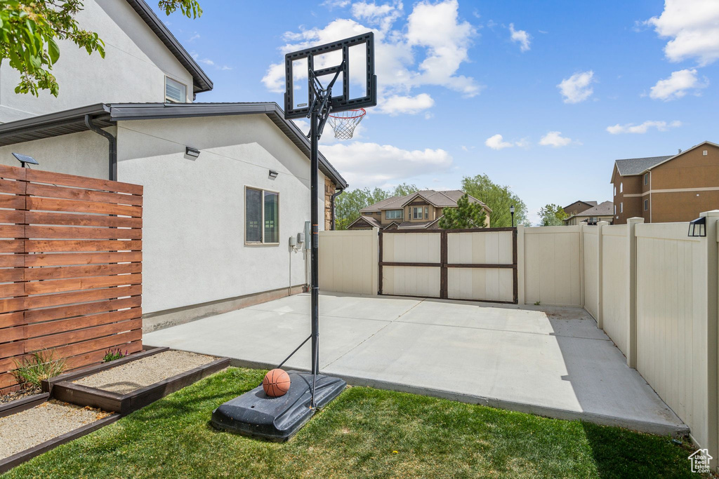 View of sport court featuring a fenced backyard