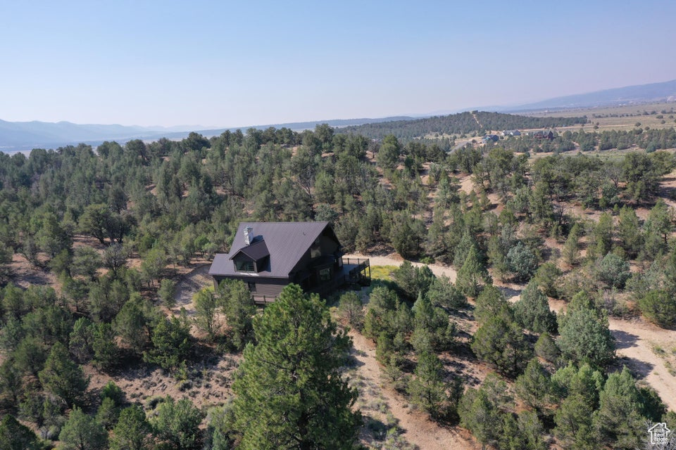 Bird's eye view with a wooded view and a mountain view