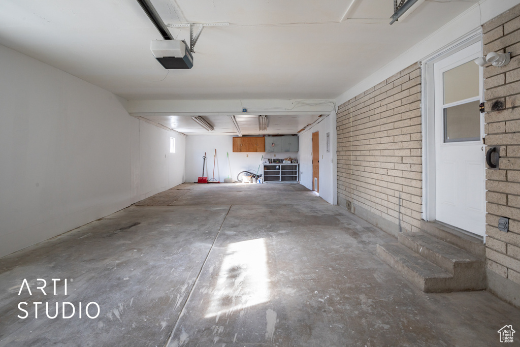 Garage featuring a garage door opener