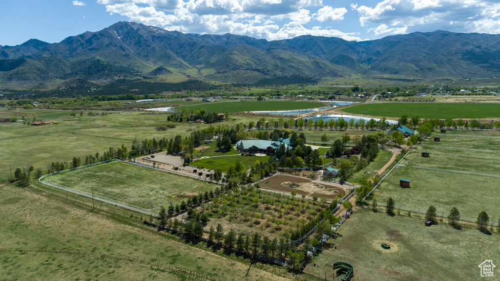 Aerial view featuring a water and mountain view and a rural view
