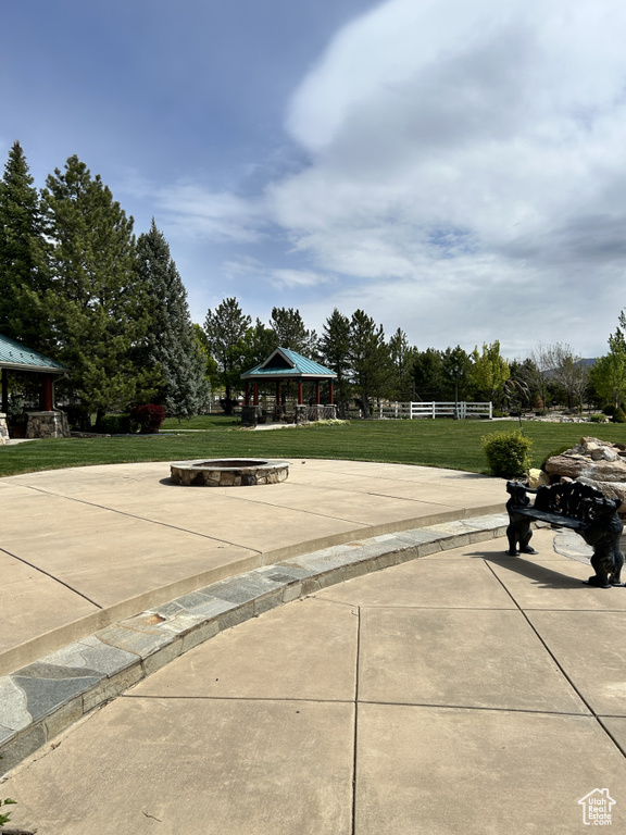 View of property's community with a gazebo and a lawn